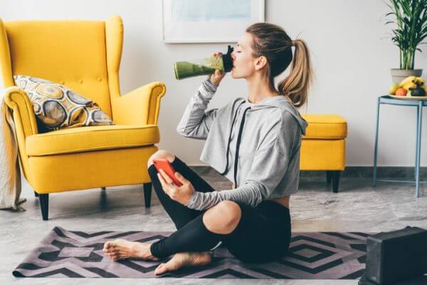 Woman having a post-workout smoothie.